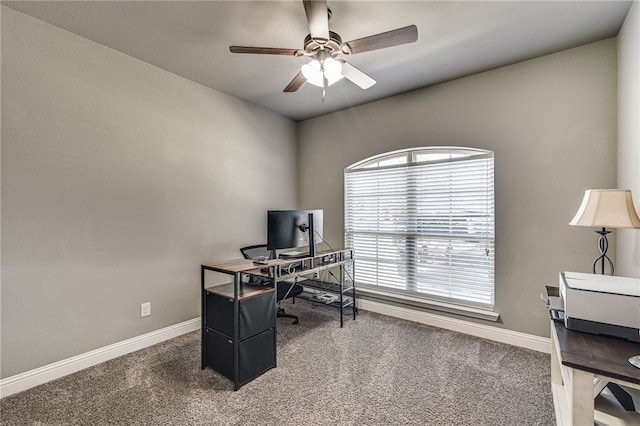 carpeted office featuring ceiling fan