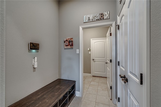 mudroom with light tile patterned floors