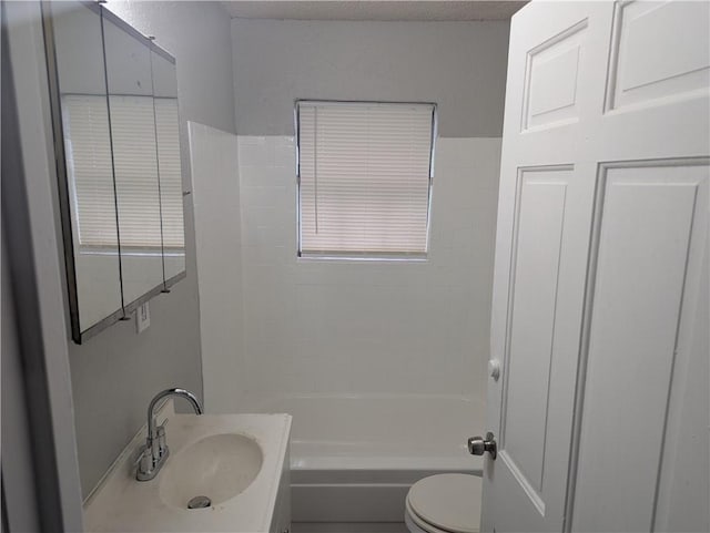 full bathroom with vanity, toilet, a textured ceiling, and bathing tub / shower combination