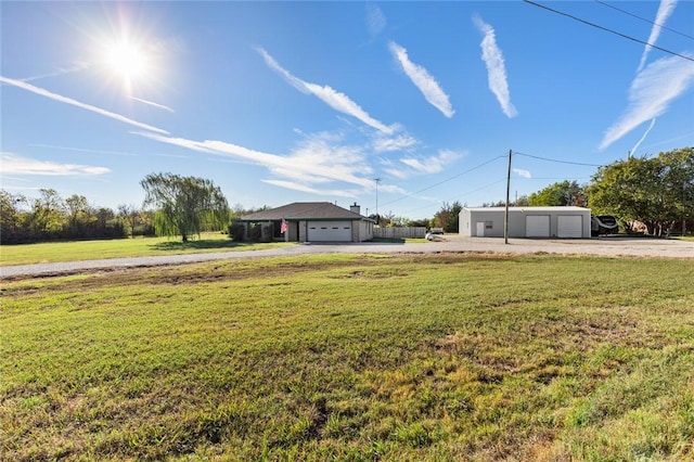 view of front of home featuring a front lawn and a garage