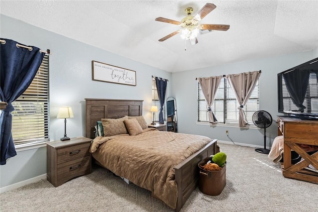 carpeted bedroom featuring a textured ceiling, ceiling fan, and vaulted ceiling