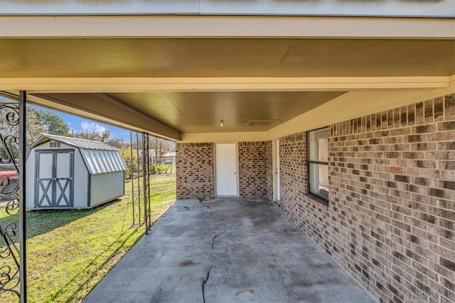 view of patio with a storage shed