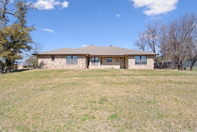 rear view of house with a yard