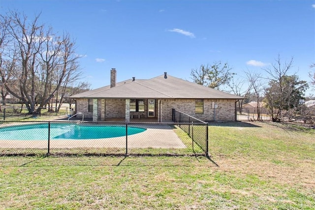 view of pool with a yard and a patio area