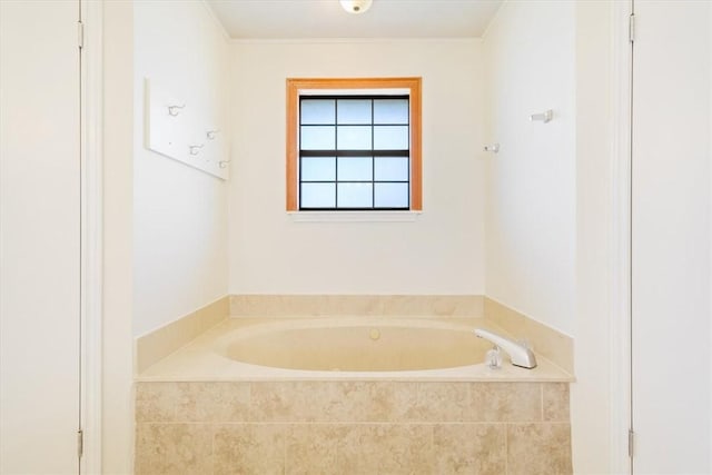 bathroom with a relaxing tiled tub