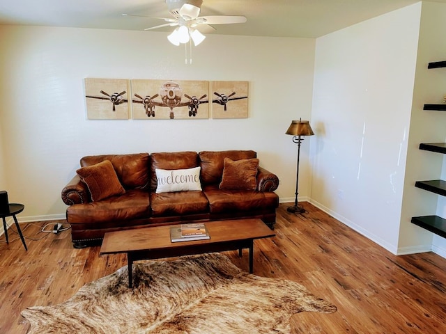 living room featuring hardwood / wood-style flooring and ceiling fan