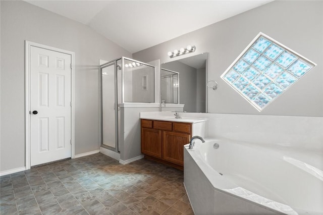 bathroom featuring plus walk in shower, vanity, and lofted ceiling