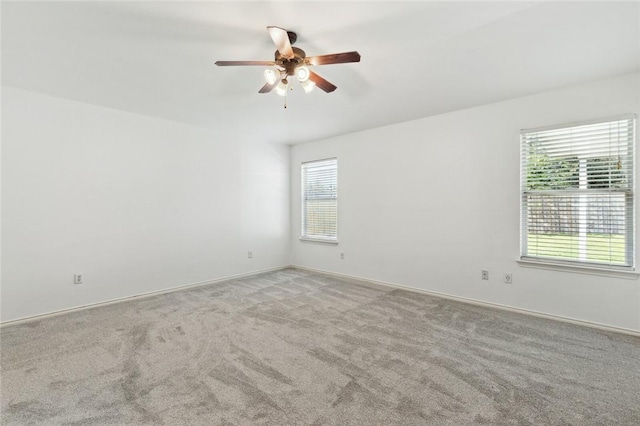 carpeted empty room with ceiling fan