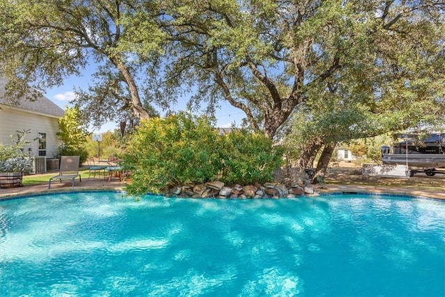 outdoor pool featuring a patio area