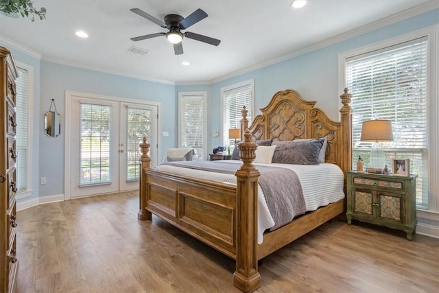 bedroom with recessed lighting, light wood-style floors, french doors, crown molding, and access to outside