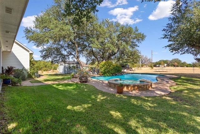 view of yard with a pool with connected hot tub, a storage unit, and an outdoor structure