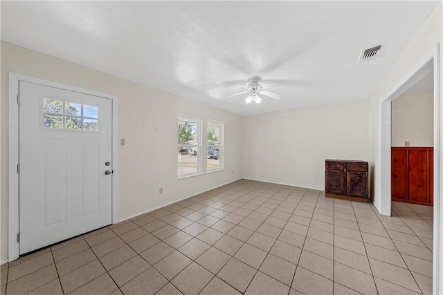 tiled foyer entrance with ceiling fan