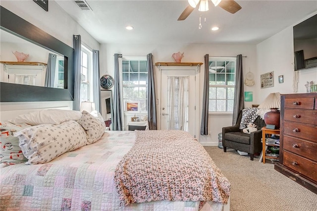 carpeted bedroom featuring ceiling fan