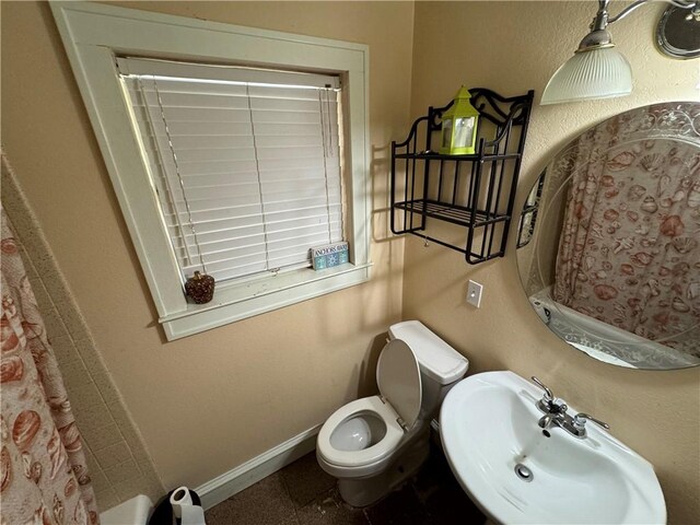 bathroom with sink and toilet