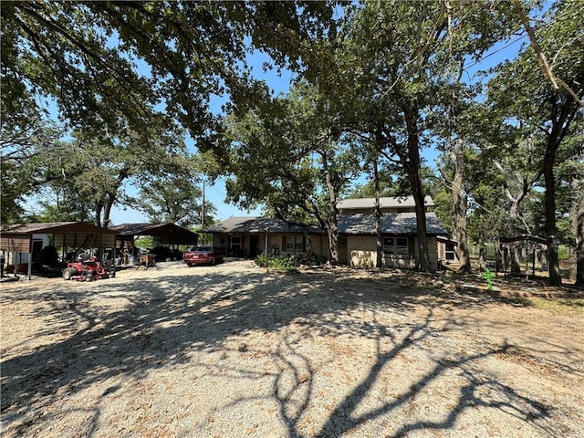 single story home with a carport