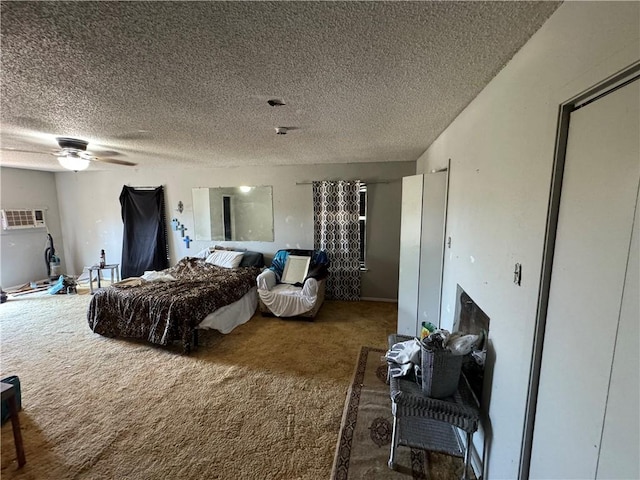 carpeted bedroom with a textured ceiling and ceiling fan