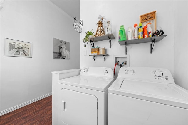 washroom with dark hardwood / wood-style flooring and washer and dryer