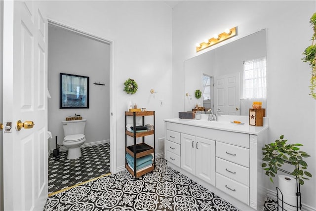 bathroom featuring toilet and vanity