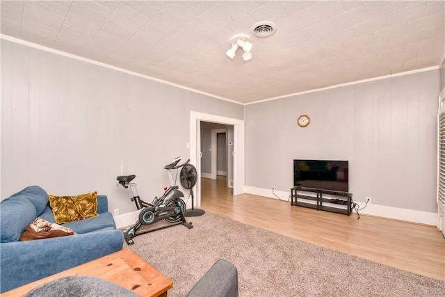 living room featuring carpet flooring and ornamental molding