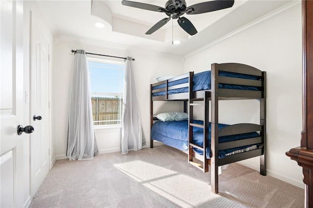 bedroom featuring light carpet, ceiling fan, and crown molding