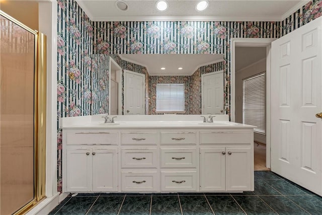 bathroom with vanity, tile patterned floors, crown molding, and a shower with shower door