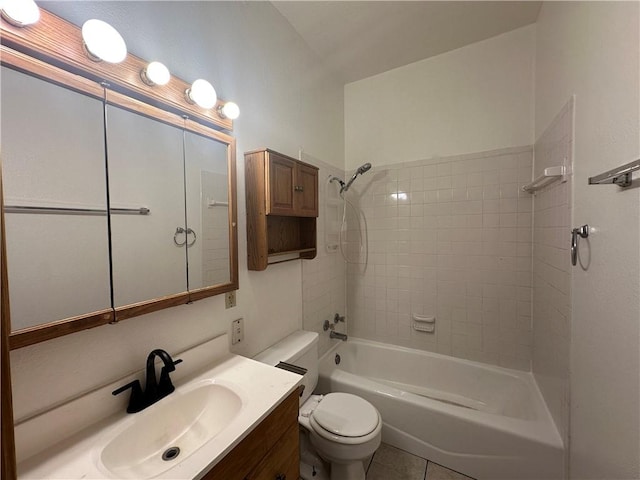 full bathroom featuring tile patterned floors, toilet, vanity, and tiled shower / bath