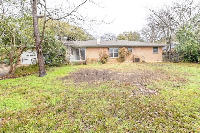 ranch-style home with a front lawn