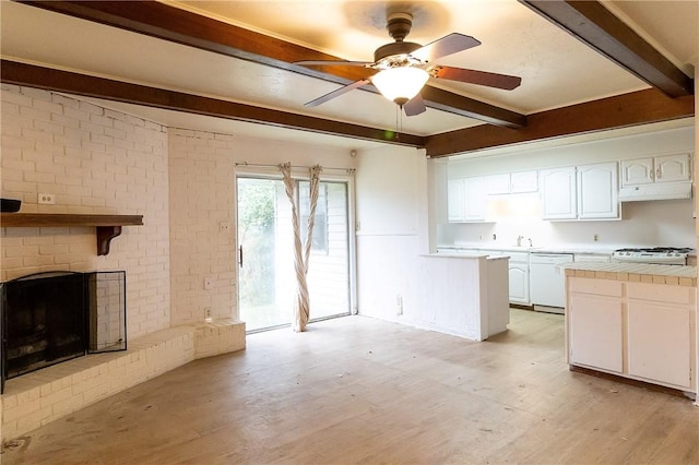 kitchen with dishwasher, white cabinetry, beam ceiling, tile counters, and light hardwood / wood-style floors