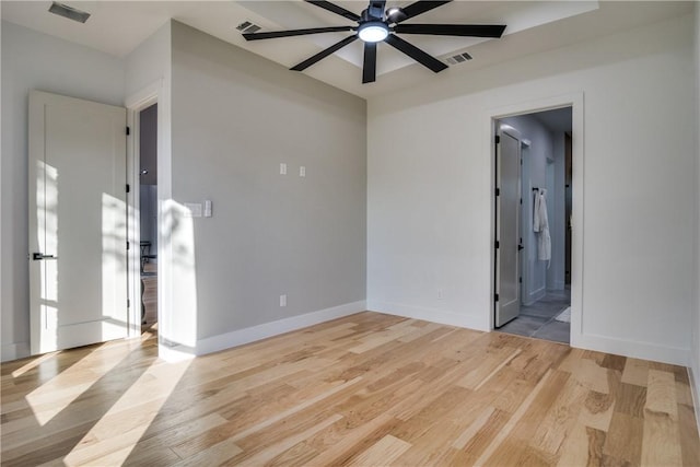 spare room with light wood-type flooring and ceiling fan