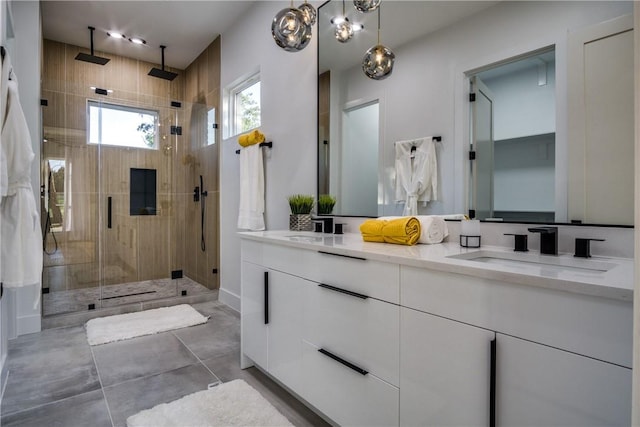 bathroom featuring tile patterned flooring, vanity, and a shower with shower door