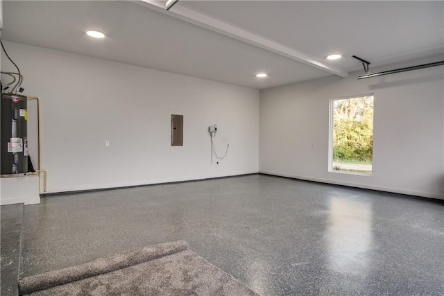 garage featuring electric panel and water heater