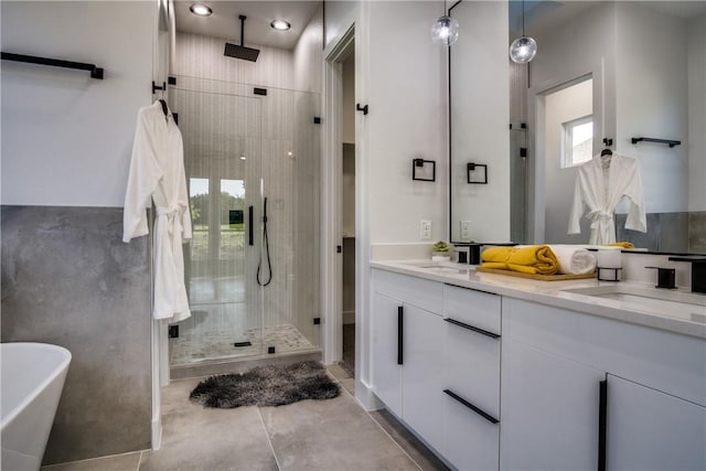 bathroom with tile patterned flooring, vanity, and independent shower and bath