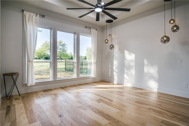 unfurnished room featuring light wood-type flooring and ceiling fan