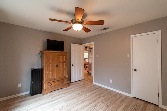 unfurnished bedroom featuring ceiling fan and light hardwood / wood-style flooring