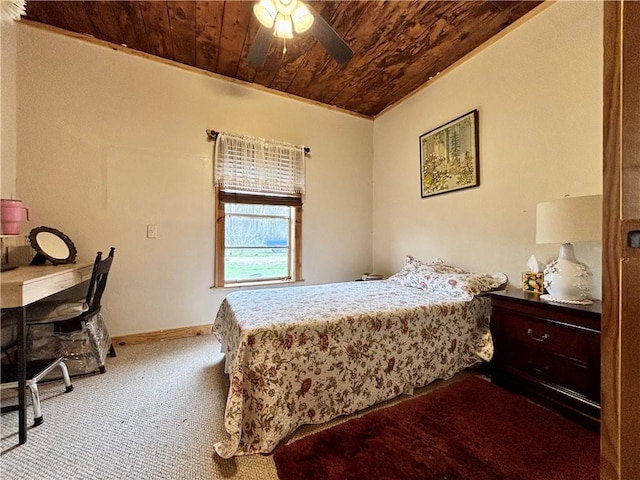 carpeted bedroom with wooden ceiling, baseboards, and a ceiling fan