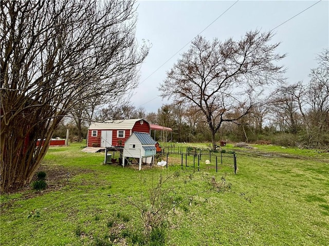 view of yard featuring an outbuilding and exterior structure