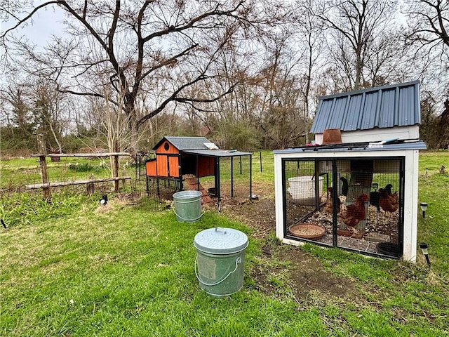 view of yard featuring exterior structure and an outdoor structure