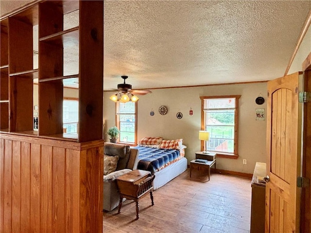 bedroom featuring hardwood / wood-style flooring and a textured ceiling