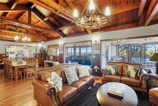 living room featuring vaulted ceiling with beams, wood ceiling, ceiling fan with notable chandelier, and light hardwood / wood-style flooring