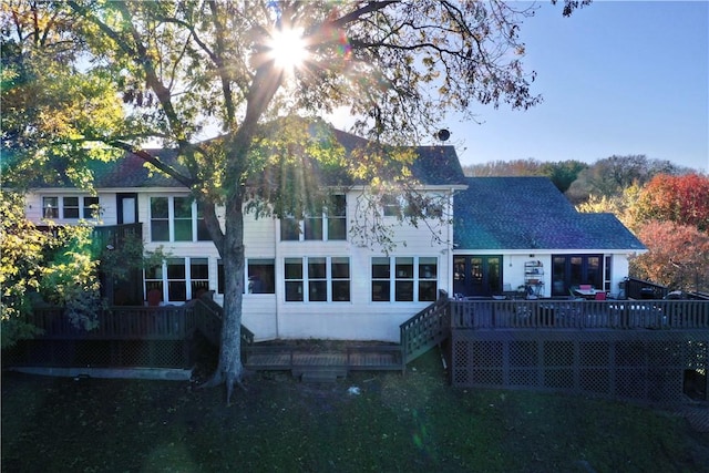 rear view of property with a wooden deck