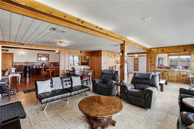 living room featuring wood walls