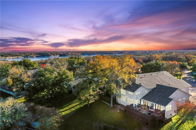 aerial view at dusk with a water view