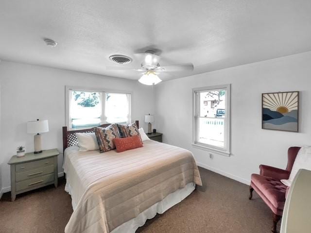 carpeted bedroom with ceiling fan