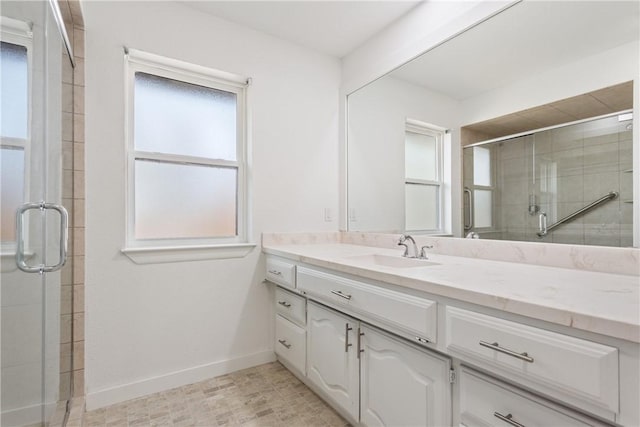 bathroom featuring vanity and an enclosed shower