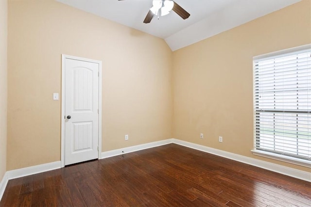 empty room featuring ceiling fan, hardwood / wood-style floors, and lofted ceiling