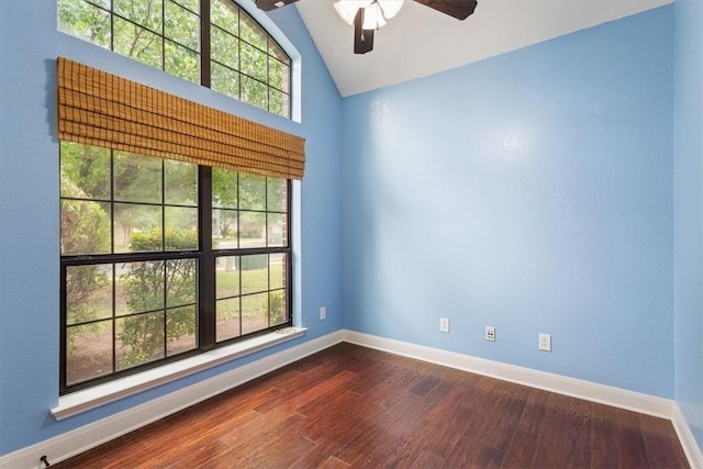 spare room featuring hardwood / wood-style flooring, lofted ceiling, and ceiling fan