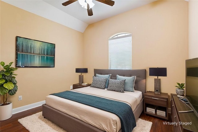 bedroom featuring lofted ceiling, ceiling fan, and dark hardwood / wood-style flooring