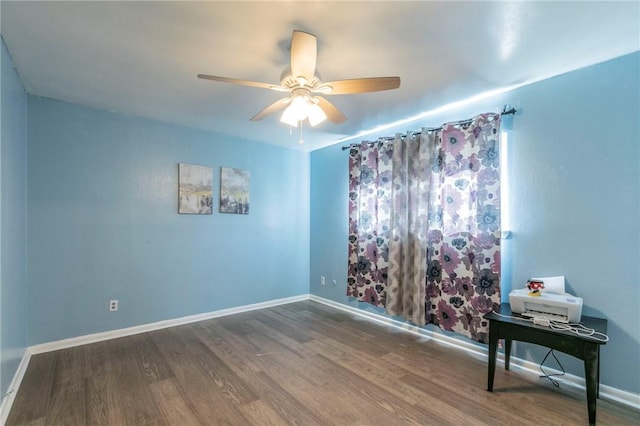 unfurnished room with hardwood / wood-style floors and ceiling fan