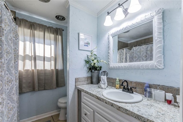 bathroom with tile patterned floors, vanity, toilet, and crown molding