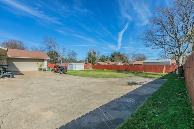 view of yard featuring a garage